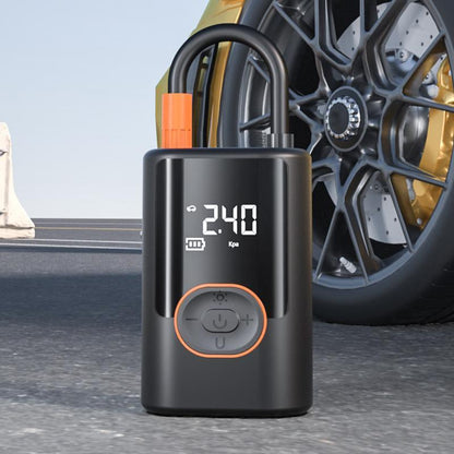 ZORA portable air compressor inflating a car tire with real-time digital pressure display.